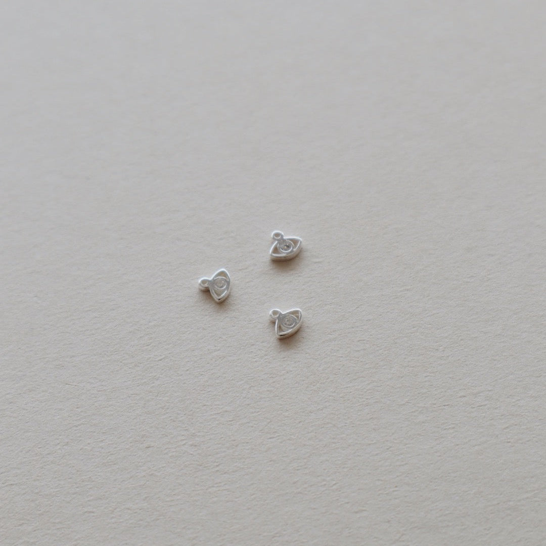 Zircon Eye Charm