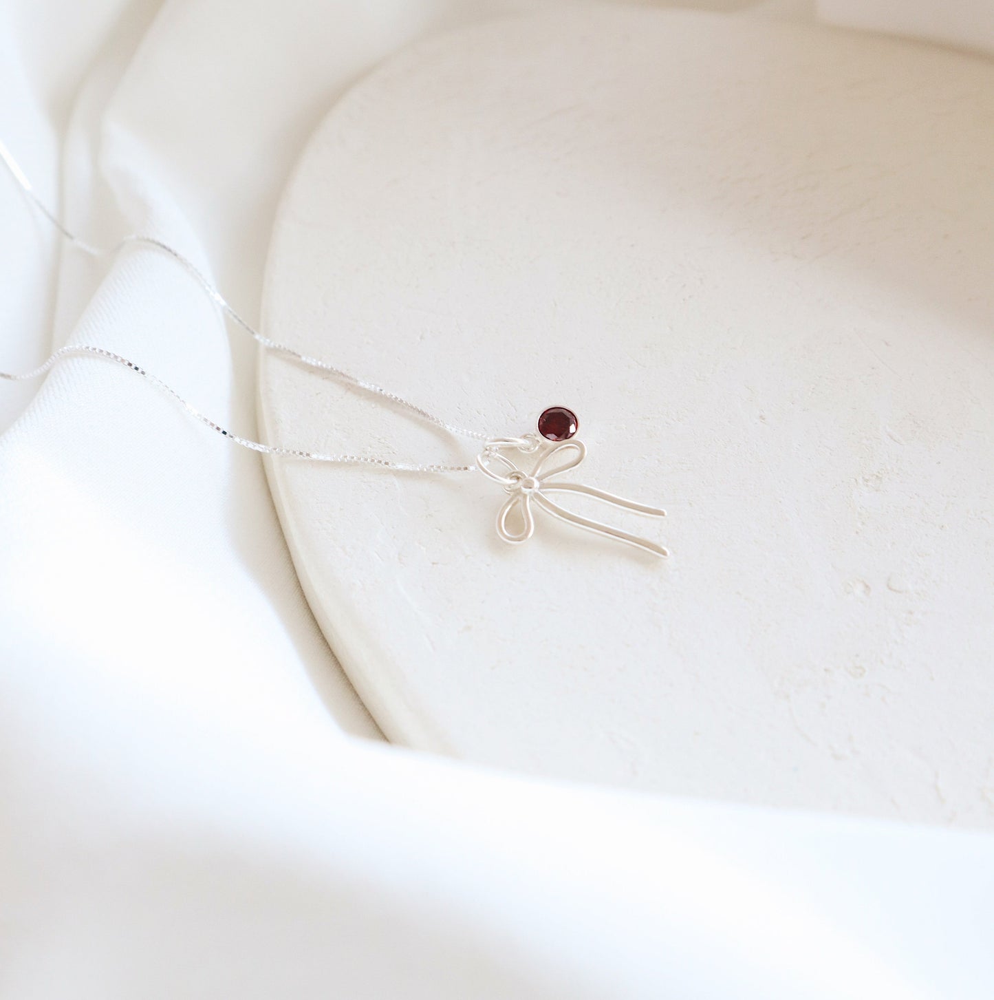 Bow and Garnet Necklace PeacePiecesJewelry
