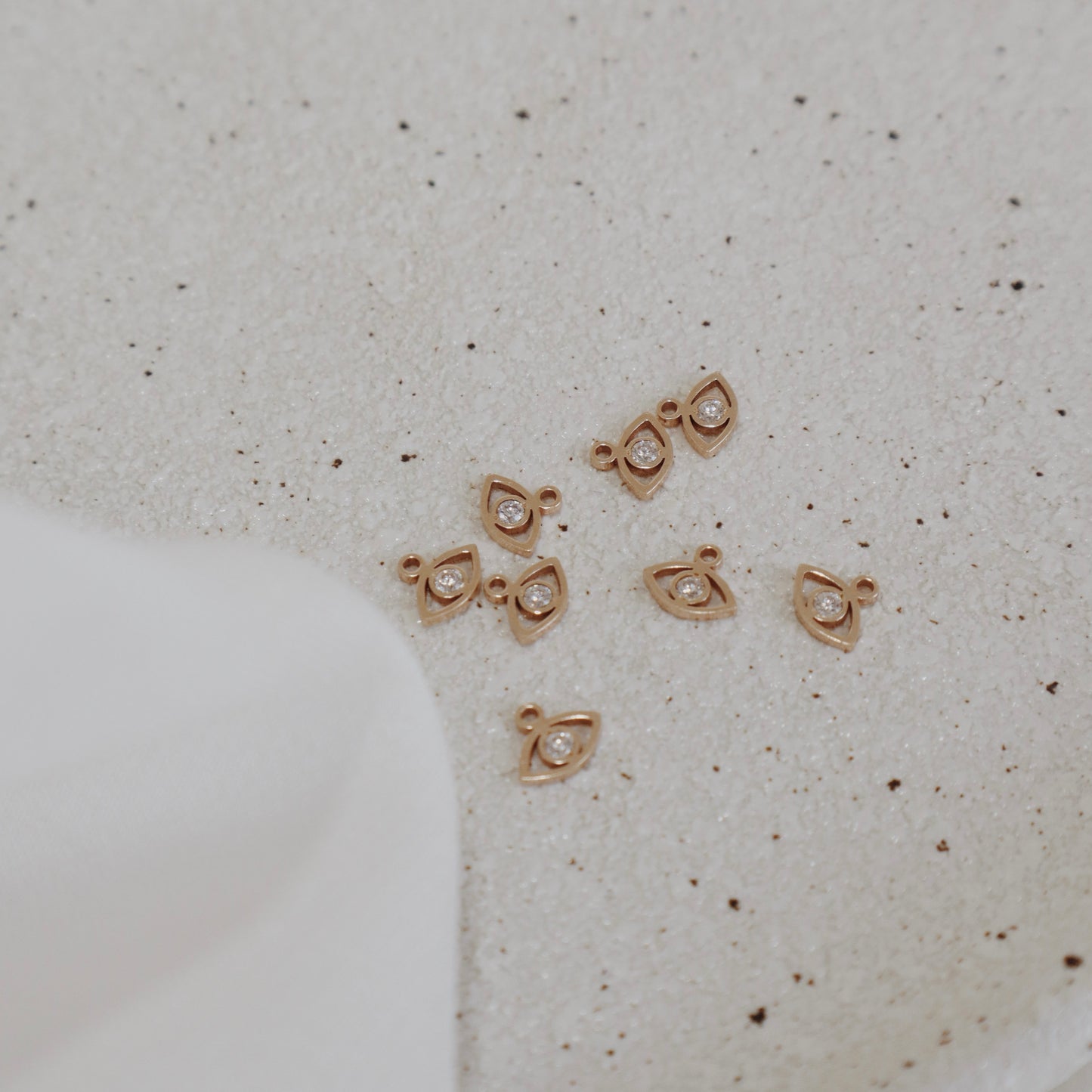 Zircon Eye Charm