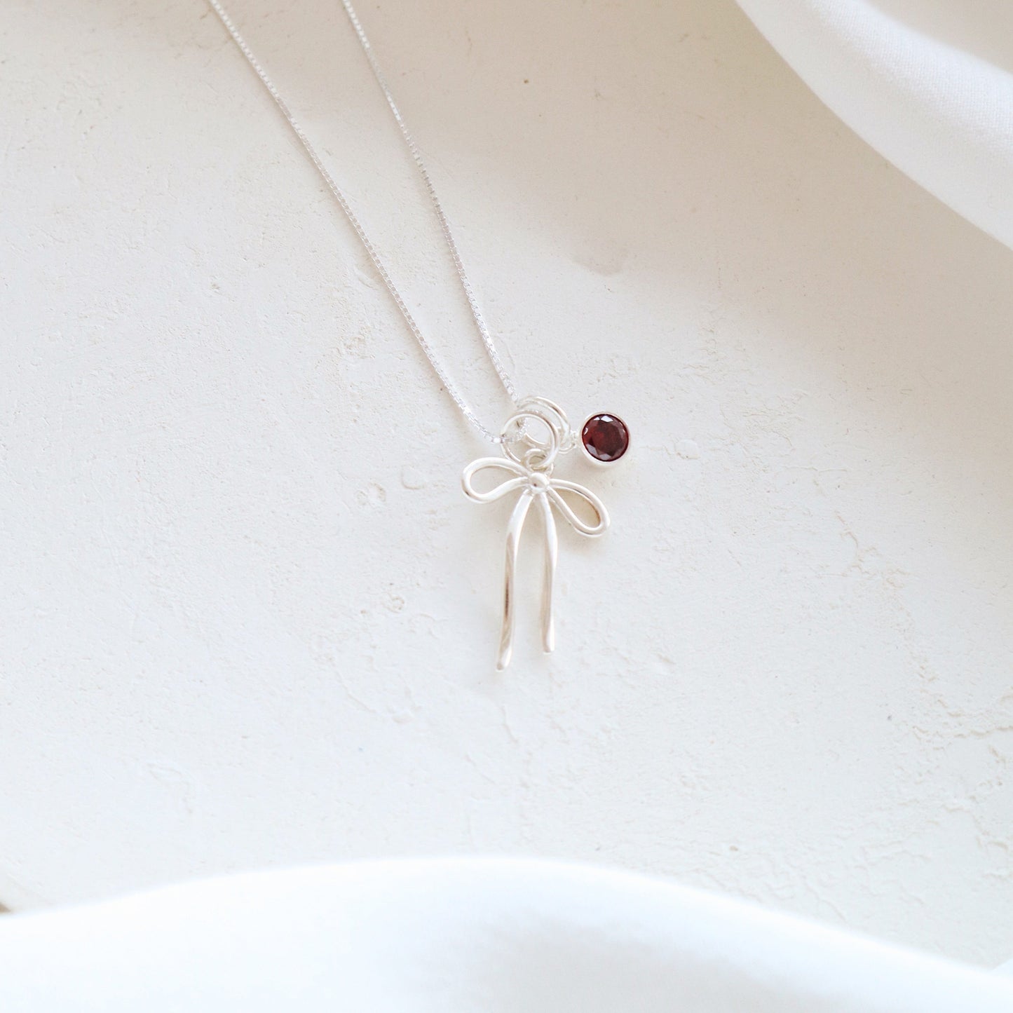 Bow and Garnet Necklace PeacePiecesJewelry