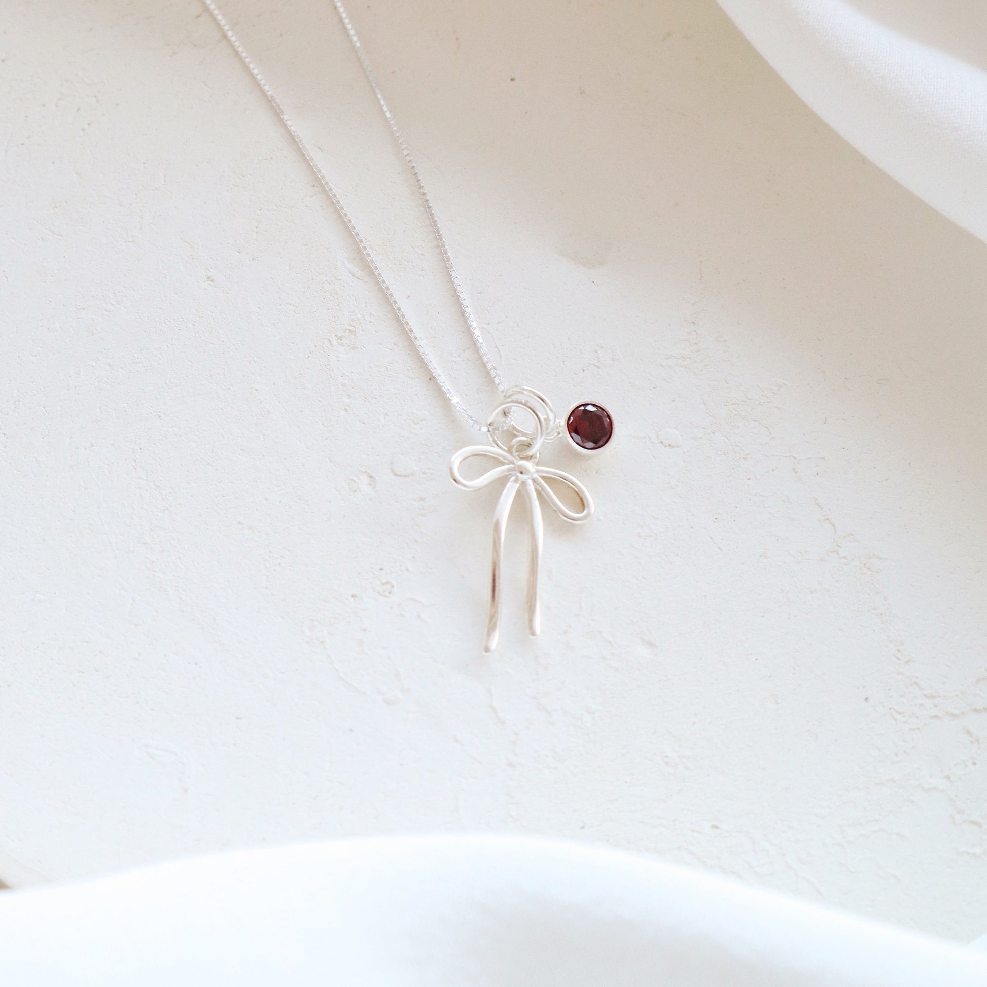 Bow and Garnet Necklace PeacePiecesJewelry